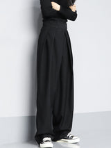 Zwarte wijde pantalon full body shot

