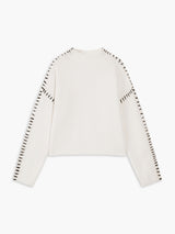 Witte mock neck sweater met zwarte details

