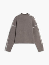 Grijze trui met mock neck en opengewerkte details
