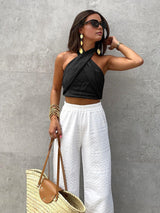 Zwarte haltertop met gekruiste bandjes en linnen look
