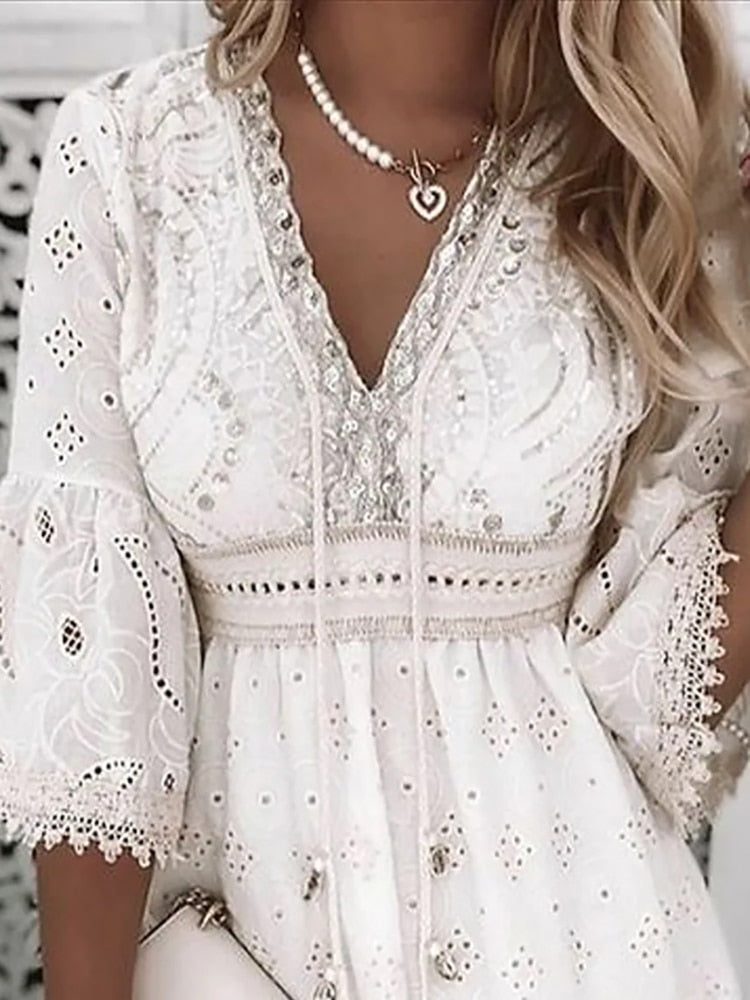 Witte boho jurk met borduursels en 3/4 mouwen
