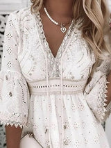 Witte boho jurk met borduursels en 3/4 mouwen
