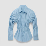 Lichtblauwe oversized blouse met elastiek