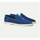 Donkerblauwe suède-look instapper met witte zool
