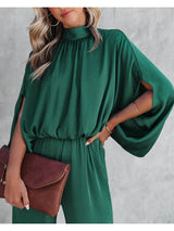 Elegante groene jumpsuit dames hoge kraag

