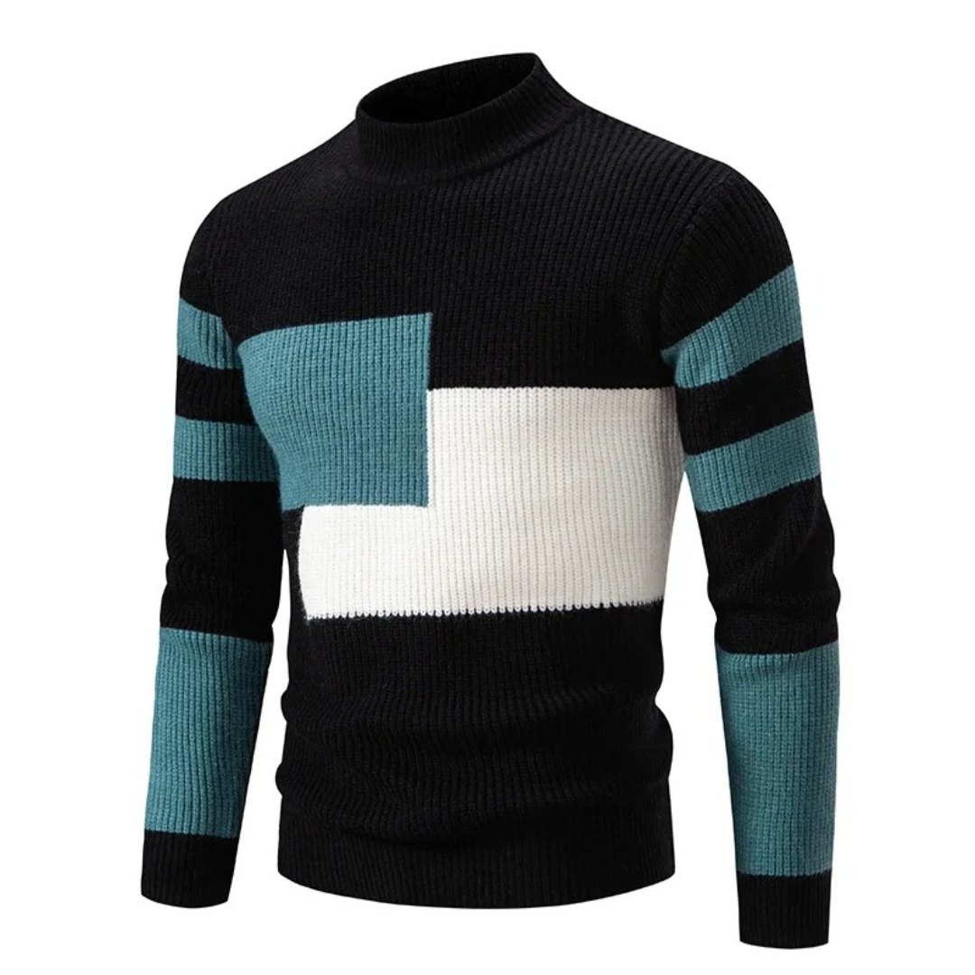 Zwarte trui met wit en turquoise kleurvlak
